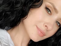 Dark curls, grey eyes and a sweet smile. That